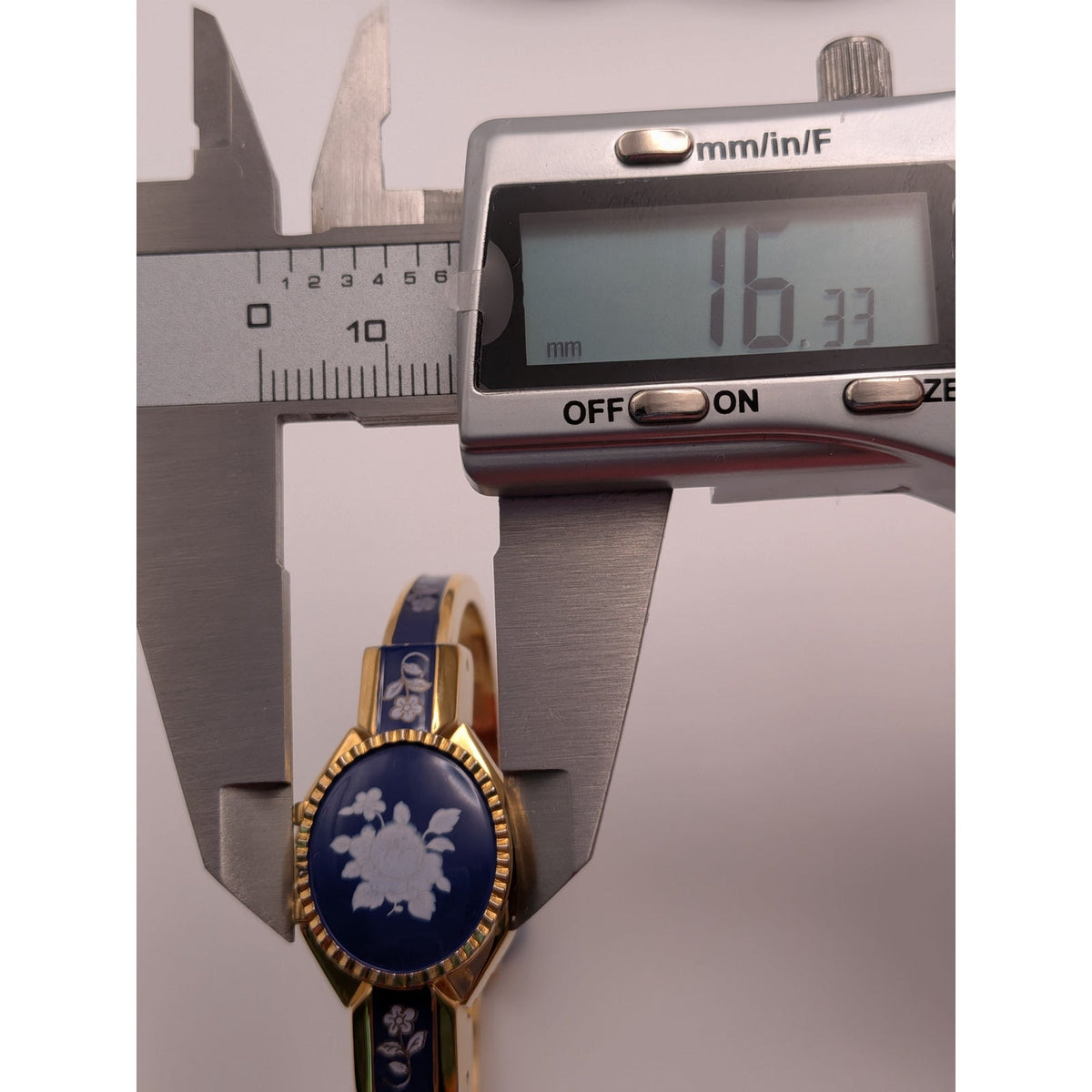 Vintage Andre Mouche Gold Tone Peekaboo Watch Dark Blue Enamel White Flowers