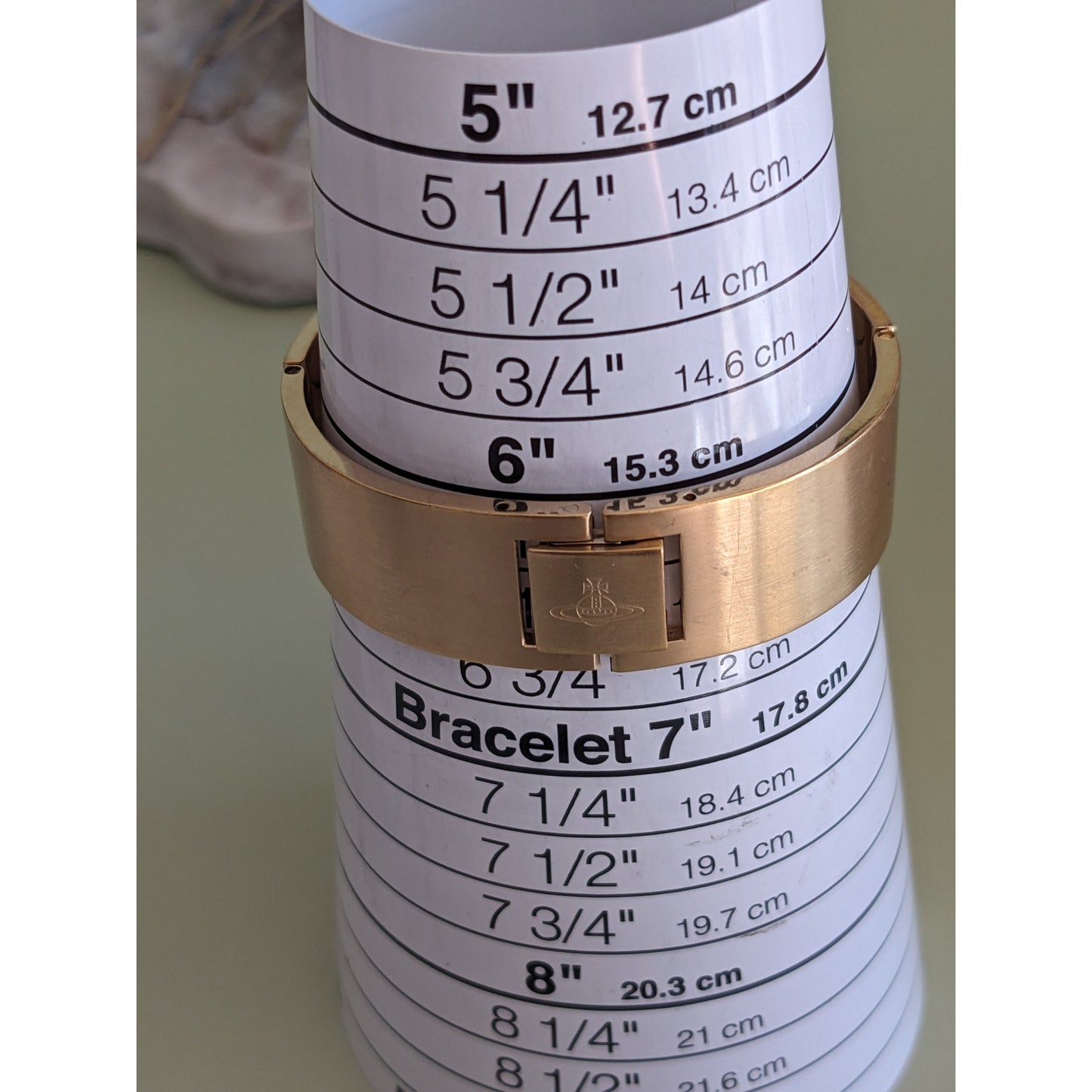 FLAW Preowned Vivienne Westwood Gold Tone Bangle Watch with Etchings 6.5in