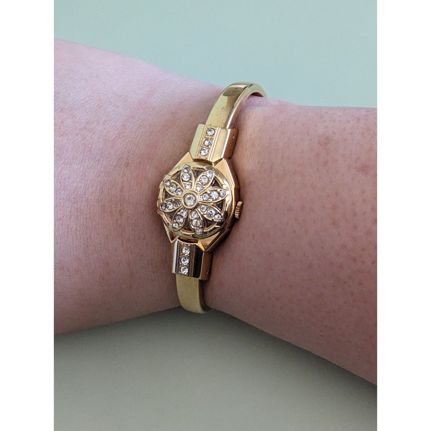 Vintage Hanowa Swiss Gold Tone Metal Bangle Watch with Flower Rhinestone