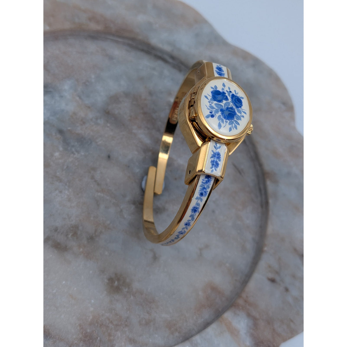 Andre Mouche Gold Tone Bangle Peekaboo Watch White Enamel Deep Blue Flowers