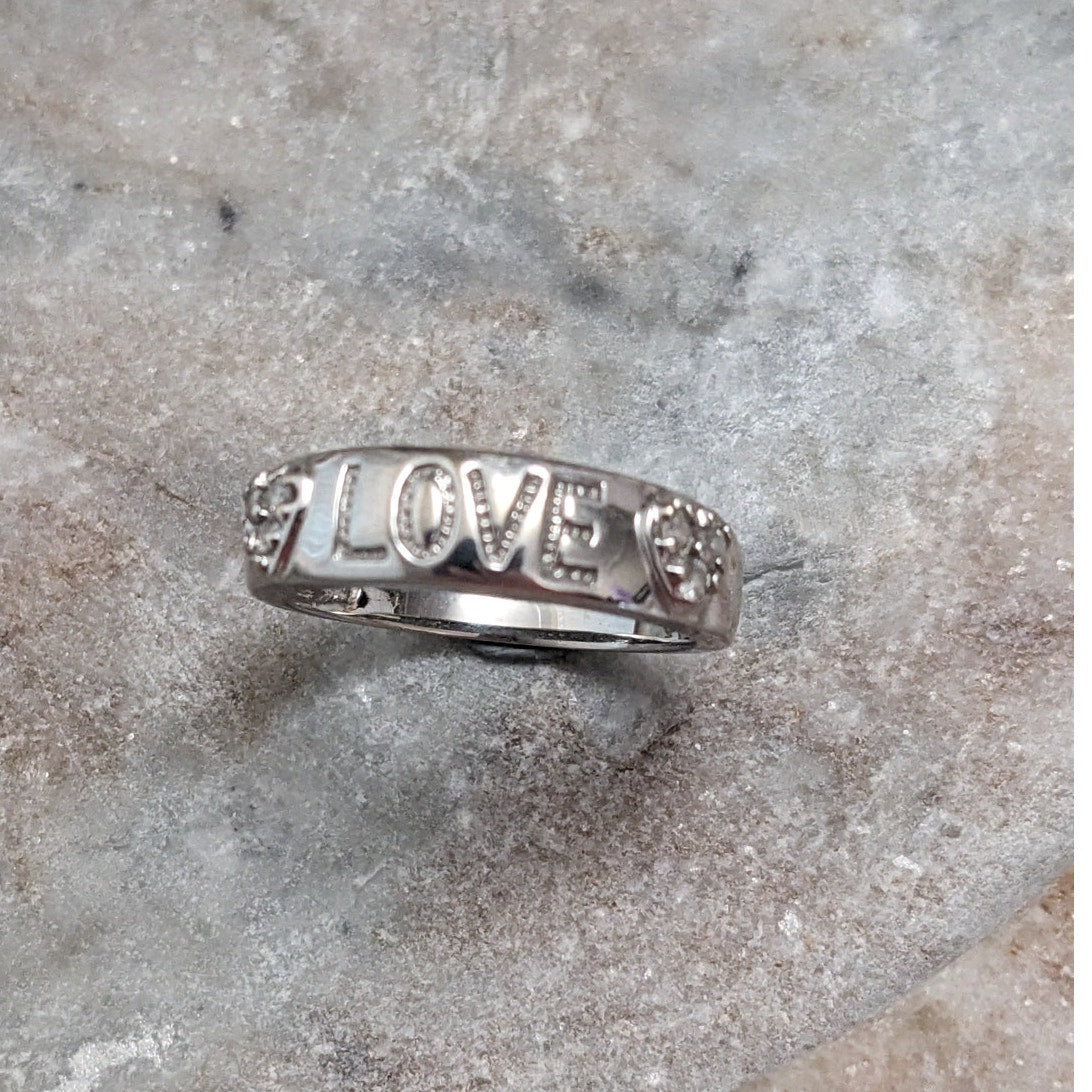Preowned 10k White Gold "LOVE" Hearts Ring with 0.12ct Diamonds Size 6.75