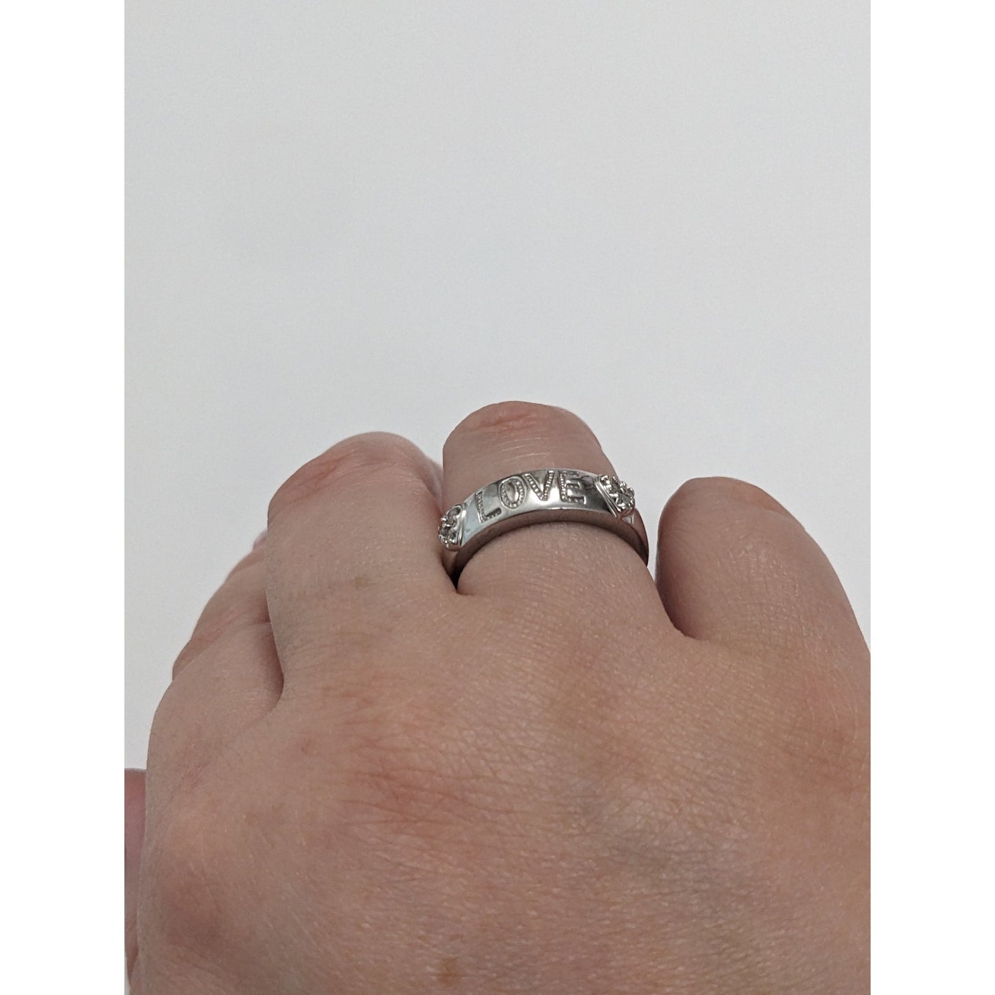 Preowned 10k White Gold "LOVE" Hearts Ring with 0.12ct Diamonds Size 6.75