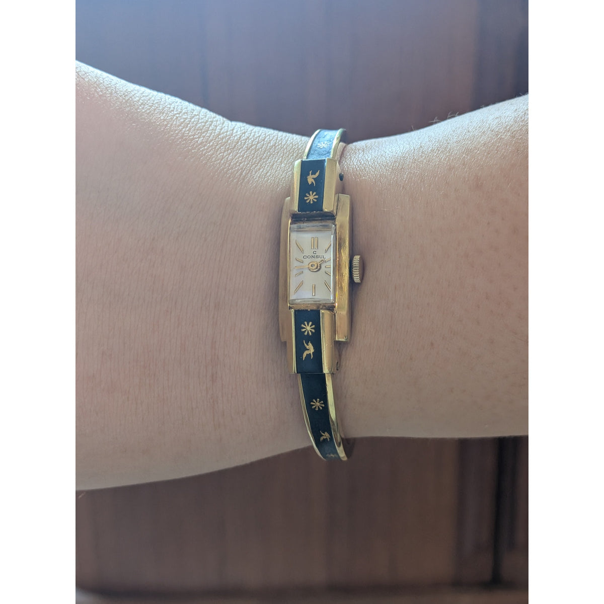 Vintage Consul Gold Tone Watch Matte Black Enamel Bird and Flower Accents