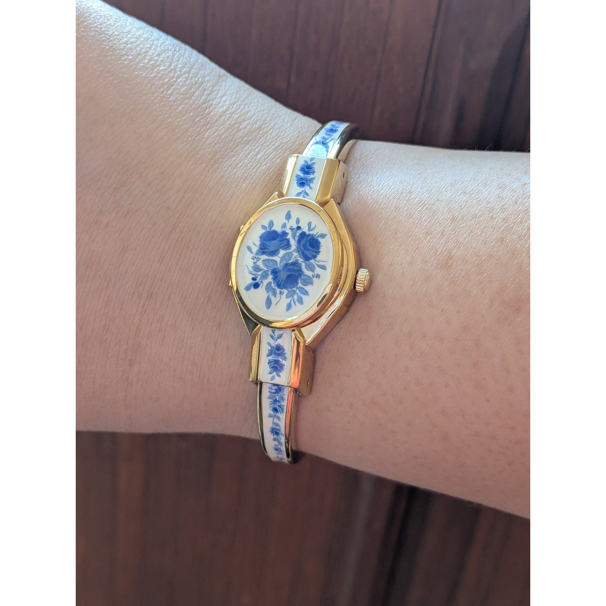 Andre Mouche Gold Tone Bangle Peekaboo Watch White Enamel Deep Blue Flowers