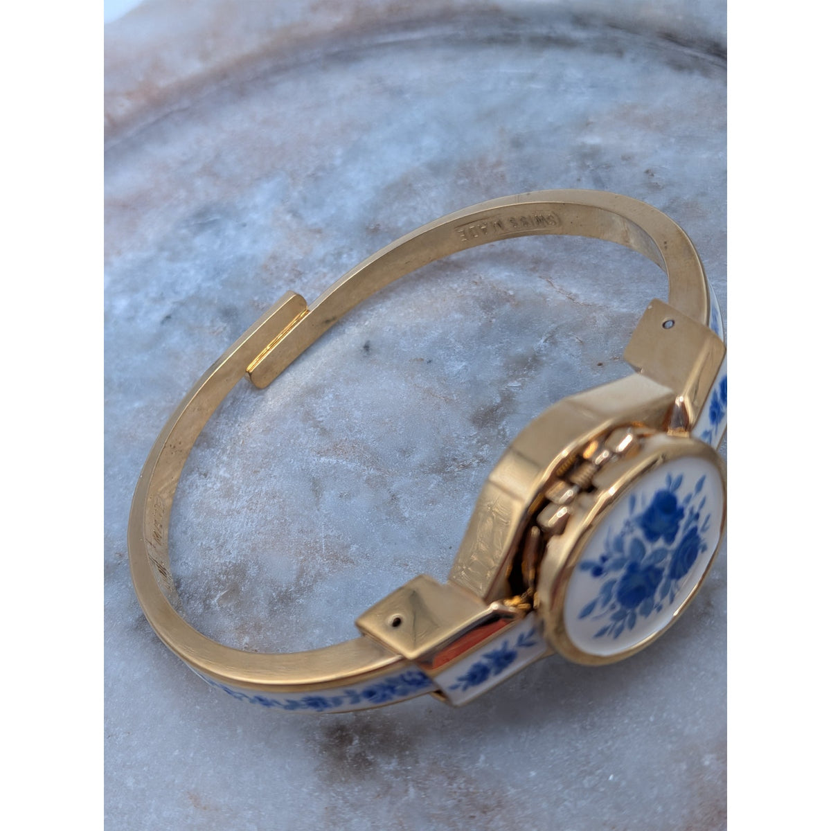Andre Mouche Gold Tone Bangle Peekaboo Watch White Enamel Deep Blue Flowers
