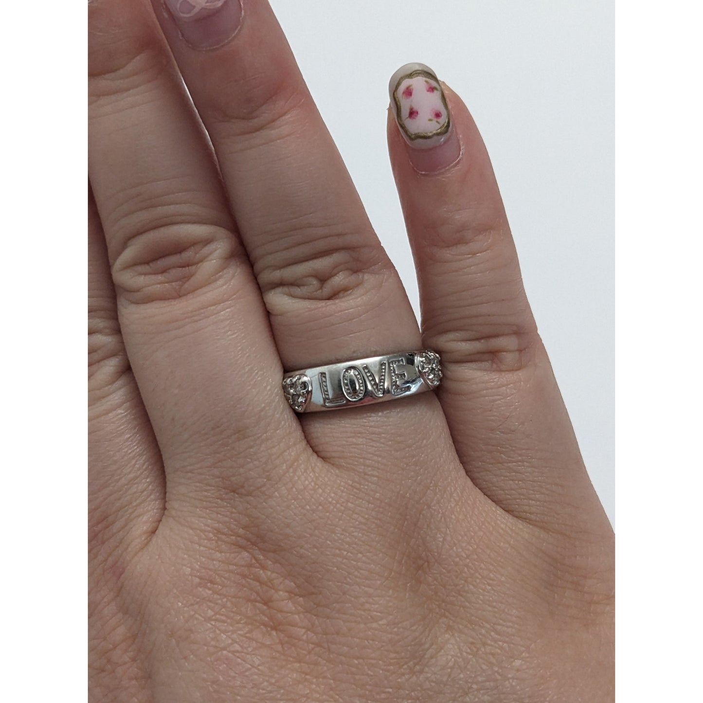 Preowned 10k White Gold "LOVE" Hearts Ring with 0.12ct Diamonds Size 6.75