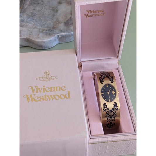 FLAW Preowned Vivienne Westwood Gold Tone Bangle Watch with Etchings 6.5in
