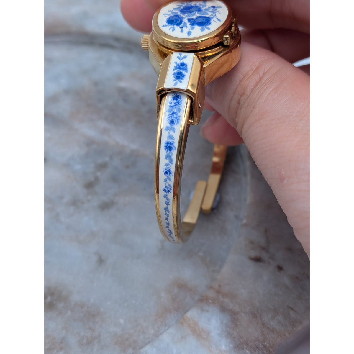 Andre Mouche Gold Tone Bangle Peekaboo Watch White Enamel Deep Blue Flowers