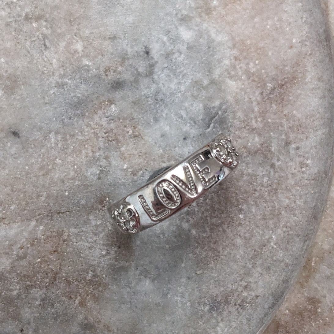 Preowned 10k White Gold "LOVE" Hearts Ring with 0.12ct Diamonds Size 6.75