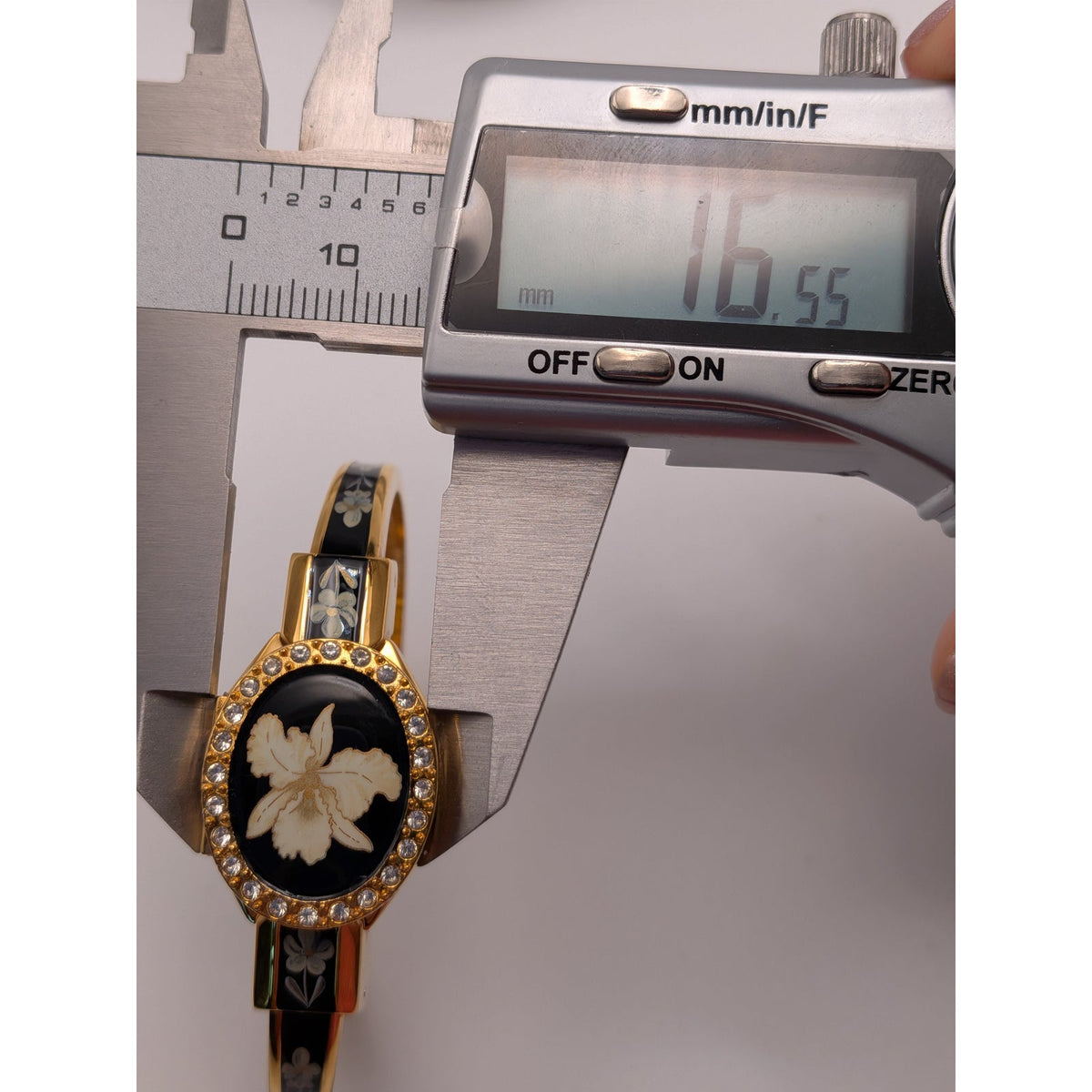 Vintage Andre Mouche Gold Tone Peekaboo Watch Black Enamel White Flower & Stones
